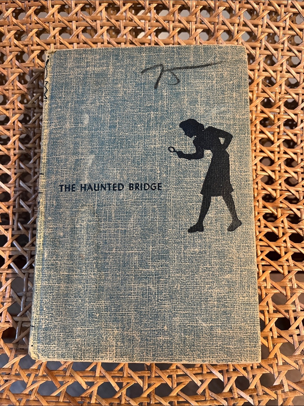 Vintage hardcover copy of The Haunted Bridge by Carolyn Keene